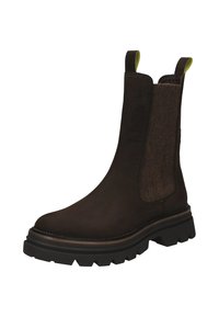 Brown leather chelsea boot with elastic side panels and pull tabs. Grooved black rubber sole for traction. Seam detailing adds structure.