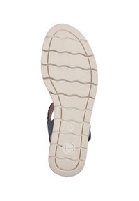 Schwarze Sandale mit konturiertem Fußbett, ausgestattet mit einer weißen strukturierten Sohle und einem gewellten Muster für besseren Halt. Größe angegeben als 37.