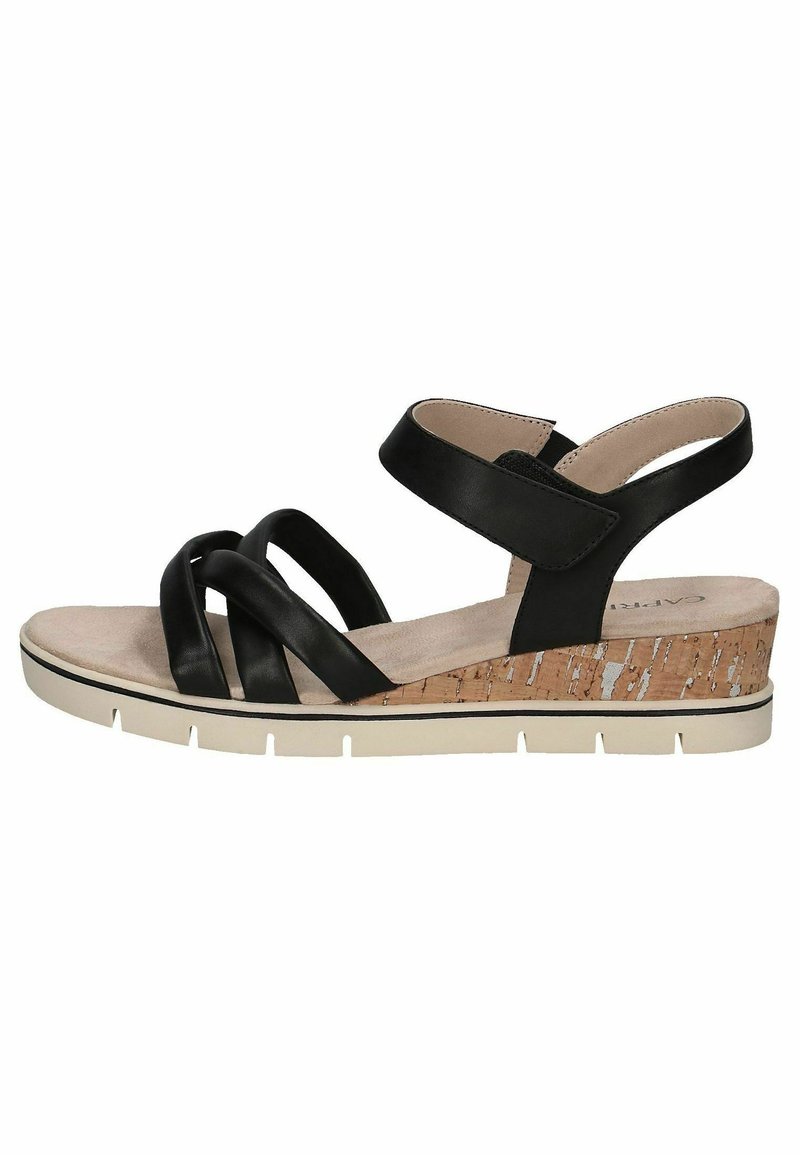 Black leather sandal with crisscross straps, cushioned insole, cork wedge heel with white accents, and a white rubber sole.