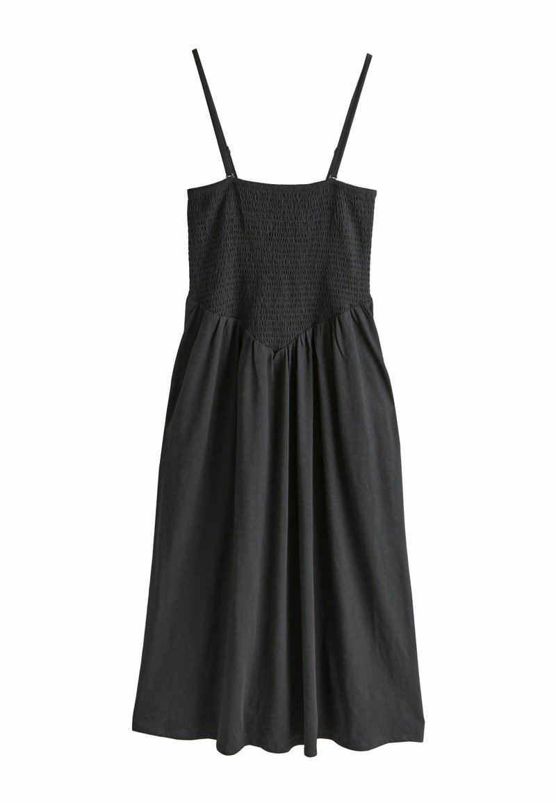 Rochie neagră cu bretele subțiri reglabile, corset cu pliuri și fustă fluidă. Confecționată dintr-un material fin, cu o croială relaxată și detalii strânse.
