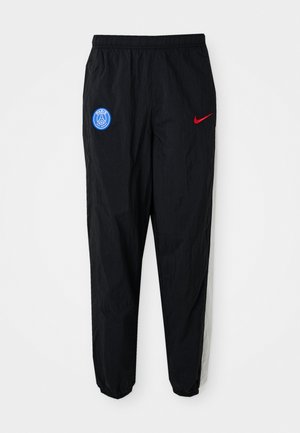 Zwarte sportbroek met een elastische tailleband, voorzien van een blauw Parijs-logo op de linkerdij en een rode Nike swoosh op de rechterdij.