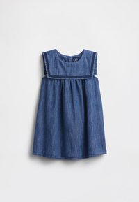 Farkkumekko keskisinisenä, hihaton, suorakaiteen muotoinen yläosa ja kerrostettu hameosa. Sileä pinta, jossa ommellut yksityiskohdat kaula-aukon ympärillä.