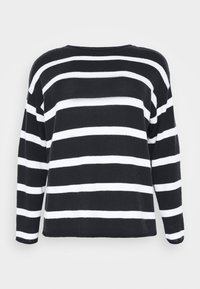 Maglione a righe bianche e nere a maniche lunghe, con una vestibilità ampia, scollatura rotonda e polsini e orlo a coste. Texture morbida del tessuto a maglia.