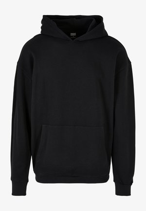 Hanorac negru cu glugă, realizat dintr-un material moale. Prezintă o buzunar frontal tip pouch, manșete ribbate și o croială lejeră, fără grafică vizibilă.