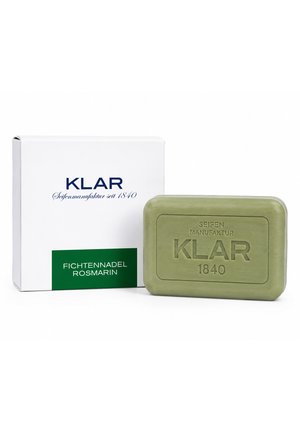 Green bar soap labeled KLAR 1840 next to white box with KLAR branding and "Fichtennadel Rosmarin" text.