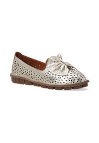 Metallic gold slip-on shoe with perforated pattern, rounded toe, and bow accent on the vamp. Brown rubber sole with slight traction.