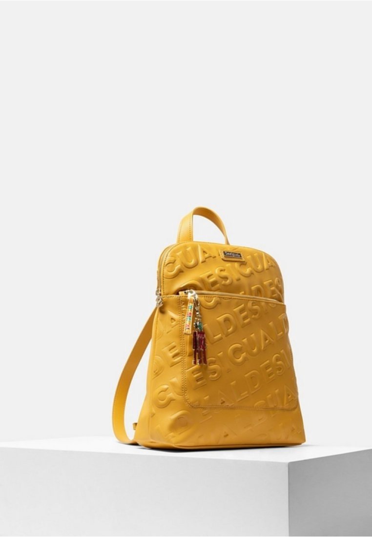 Yellow faux leather backpack with embossed logo pattern, front zip pocket featuring multicolored tassels, adjustable shoulder straps.