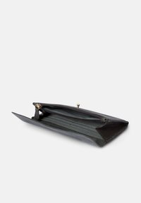 Black leather wallet with a zippered closure, featuring internal compartments and a flat design; smooth texture and minimalistic style.