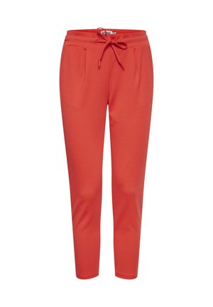 Red tapered sweatpants with an elastic waistband and drawstring, featuring side pockets and a smooth fabric texture.