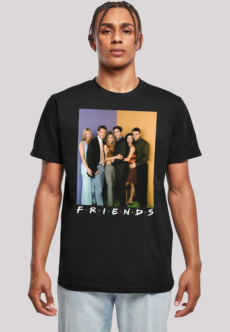 Svart bomulls t-skjorte med et fargerikt grafisk trykk av seks personer, med ordet "FRIENDS" vist i hvitt under.