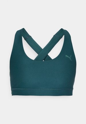 Sutia desportivo em teal com um design sem costuras, tiras cruzadas nas costas e um pequeno logótipo na parte da frente. Feito de um tecido elástico e respirável.