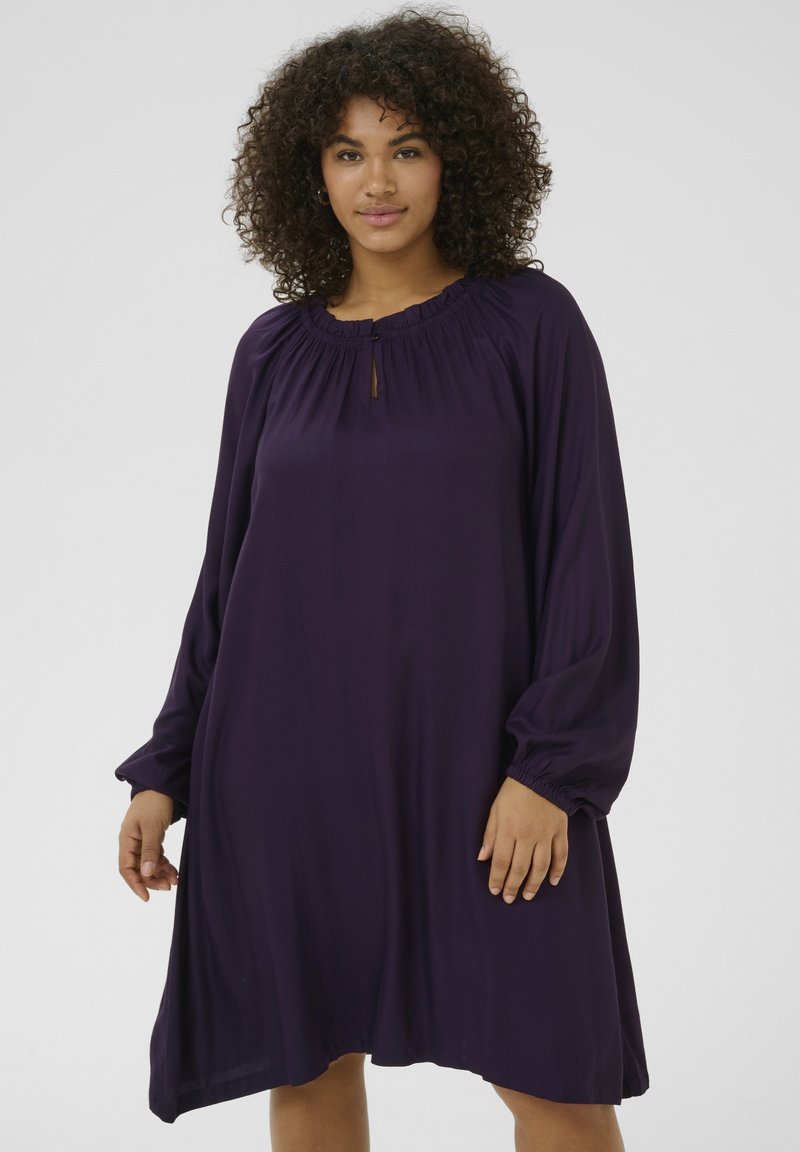 Purple long-sleeve dress with a gathered neckline and a keyhole detail. Soft fabric with a loose fit and elasticized cuffs.