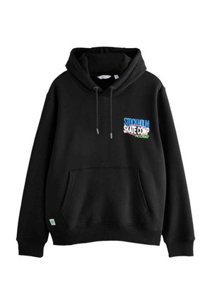Black hoodie in fleece material with a front pocket. Features a colorful "Stockholm Skate Comp" graphic on the chest. Drawstring hood detail.