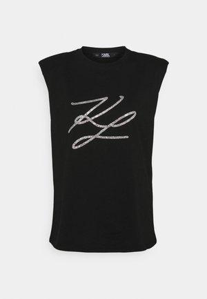 Czarna koszulka bez rękawów z poduszkami na ramionach i stylizowanym logo "KL" z kryształków na środku z przodu.