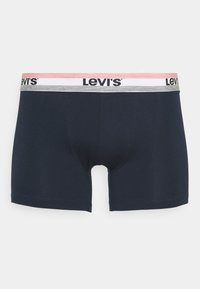 Boxer in cotone stretch blu scuro con una cintura logata che presenta strisce rosa e argento. Texture liscia e taglio di lunghezza media.