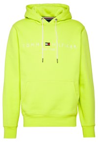Felpa con cappuccio gialla neon in misto cotone, dotata di tasca frontale, cappuccio con cordino e testo del logo bianco con un piccolo emblema colorato.