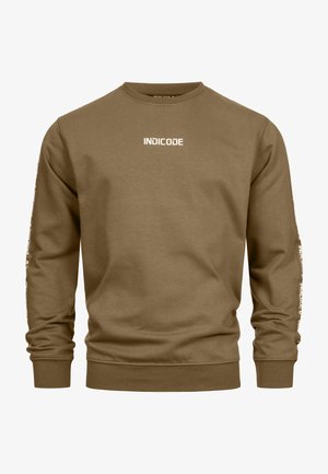 Brauner Sweatshirt aus Baumwolle mit rundem Halsausschnitt, langen Ärmeln und dem Wort "INDICODE" in Weiß auf der Vorderseite und den Ärmeln bedruckt.