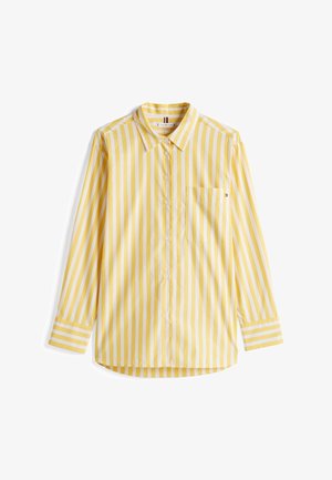 Camisa de manga larga a rayas amarillas con cuello, botones en el frente y un bolsillo en el lado izquierdo. Presenta rayas blancas alternas delgadas y gruesas.