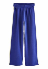 Pantaloni de trening albaștri cu o croială lejeră, cu un brâu elastic lat și dungi albe pe laterale. Realizați dintr-un material moale și elastic.