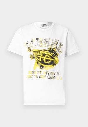 White Diesel T-shirt with a large black and yellow frog holding a football, distressed "DIESEL" text above and faded varsity-style text below.