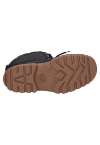 Black hiking boot featuring a textured rubber sole with deep treads, lace-up closure, and a padded collar for comfort.