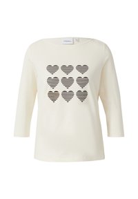 Kremowy, długorękawowy t-shirt z przodu ozdobiony wzorem dziewięciu paskowanych serc w ciemnym kolorze. Gładki bawełniany materiał, luźny krój.