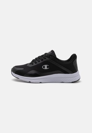 Black athletic shoe with synthetic upper, a textured finish, round toe, and cushioned white midsole; features logo on the side.