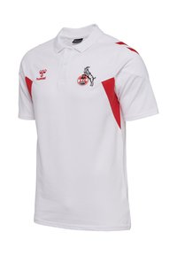 Vit pikétröja med röda detaljer, korta ärmar och krage. Har en logotyp med en get och lagets namn framtill. Tillverkad av texturerat tyg.
