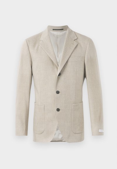 Beige len blézer, kiköpött gallérral, három fekete gombbal, két elülső zsebbel és egy mellzsebbel. Simára szövött anyag.