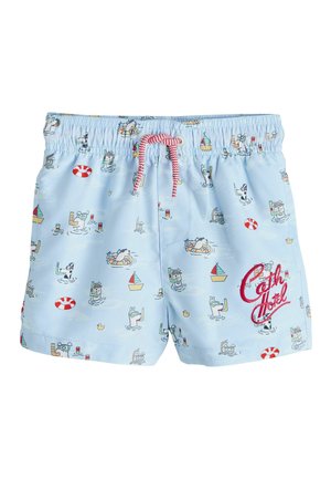 Light blue swim shorts with red drawstring, featuring playful cartoon dog scuba divers, sailboats, lifebuoys, and "Cath Hotel" text on right leg.