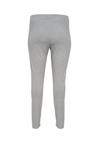Grijze leggings gemaakt van een zachte, rekbare stof, met een gladde tailleband en een strakke pasvorm. Geen extra patronen of accenten.