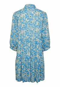 Robe bleue à manches longues avec un petit motif floral blanc et vert, un col et une jupe à volants froncés.