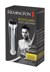 Remington Bodyguard Body Groomer emballage har et sølv- og sort design. Nøgleinformationer inkluderer titanium-belagte blade og en vandtæt funktion.