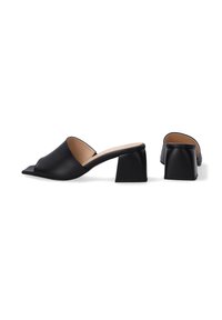 Black leather mules with an open toe, featuring a wide strap and a short square block heel. Smooth texture and simple design.