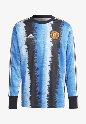 Maillot de football manches longues de Manchester United avec des rayures verticales bleues, noires et blanches et le logo Adidas sur la poitrine.