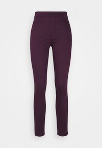 Leggings violet hechos de una tela elástica, con un ajuste ceñido, cintura alta y sin hardware visible. Textura suave, diseño minimalista.