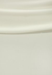 Light cream fabric with a smooth, slightly shiny texture and subtle ribbed pattern, showcasing gentle folds and drapes.