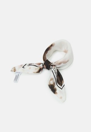 Silk scarf with brown and beige tie-dye pattern, knotted, featuring Calvin Klein logo and a visible brand tag on white background.