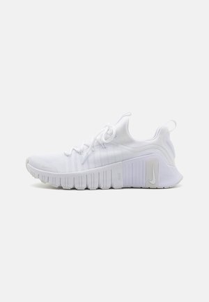 White athletic shoes with a breathable mesh upper, textured rubber sole, and flexible design. Features a prominent logo and lace-up closure.