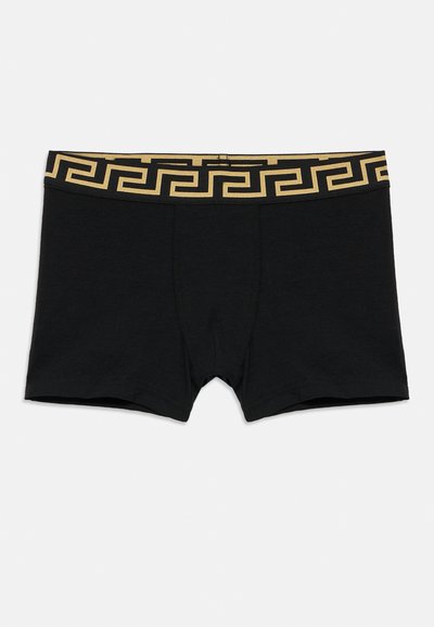 Fekete boxermerevítő arany mintás derékrésszel, görög kulcs motívummal. Puha anyagból készült, testhezálló szabással.