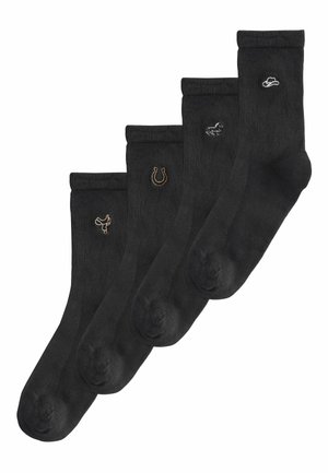 Fire sorte mandsokker med små broderede symboler: en cowboyhat, en hest, en hestesko og en dansende figur fra højre mod venstre.