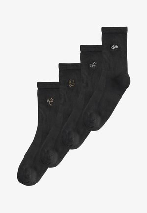 Fire sorte mandsokker med små broderede symboler: en cowboyhat, en hest, en hestesko og en dansende figur fra højre mod venstre.