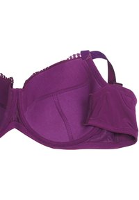 Violetinio spalvos liemenėlė iš lygaus audinio, su lankeliu palaikymui, banguotu nėriniu, ir nuimama paminkštinta puodelio dalimi, leidžiančia prisitaikyti prie Jūsų dydžio.