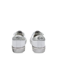 White sneakers made of leather with silver accents, round toe, flat soles, textured rubber outsoles, and branding on the heel.