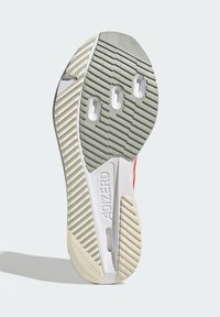 White and gray sneaker sole with textured rubber, featuring cutouts, grooves, and "ADIZERO" embossed. Distinct color contrast on edges.
