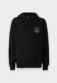 Moleton preto com bolso canguru, cordões e um logo gráfico dourado no lado esquerdo do peito. Feito de um tecido macio e texturizado.