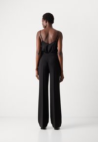 MARCIANO BY GUESS ELLA CHAIN STRAIGHT PANTS - Kalhoty - black
