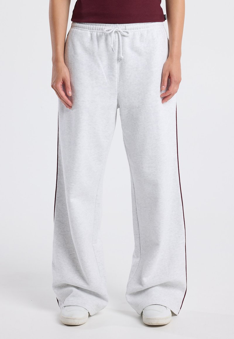Light gray sweatpants with side maroon stripes, made from soft fabric, featuring an elastic waistband and drawstring for adjustable fit.