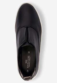 Black leather slip-on shoe with stitched design, elastic side panels, and white rubber sole. Interior features logo and size details.