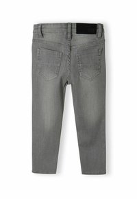 Sive traper hlače s slim fit krojem, pet žepnim oblikovanjem in črnim pasom. Imajo subtilno zbledelost in podrobnosti kontrastnega šivanja.